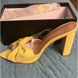 Illude yellow chunky heels with a bow